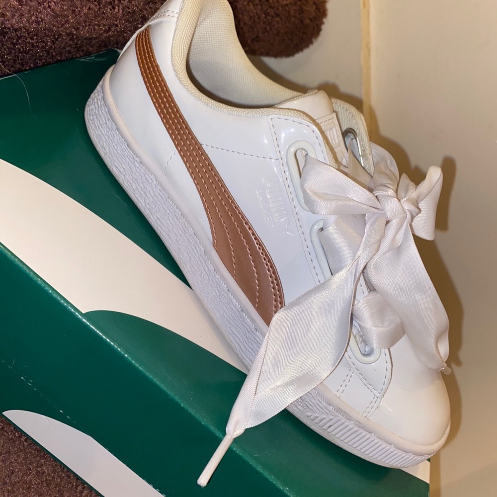 white and rose gold pumas
